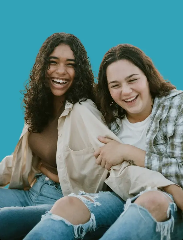 Two college students laughing together